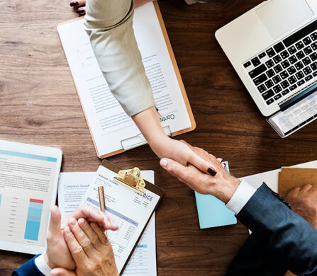 An attorney shaking a clients hand.