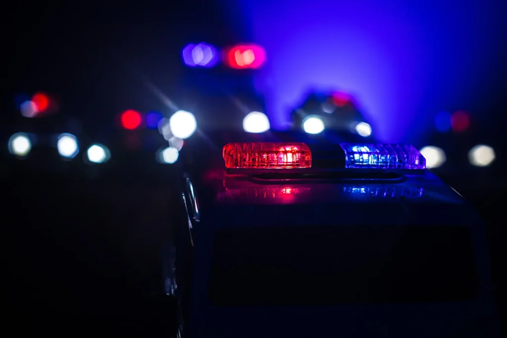 Police cars with the strobes on.