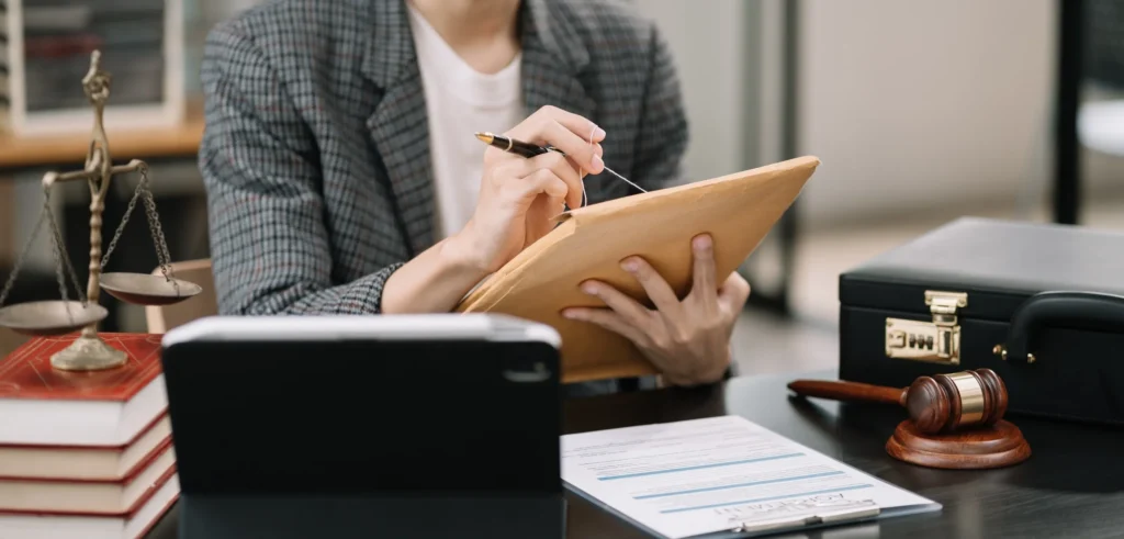 An attorney opening a case folder.