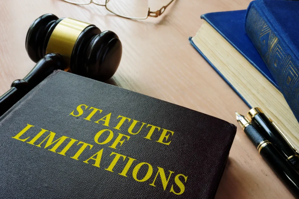 Book of the State of Limitations with a wooden gavel.